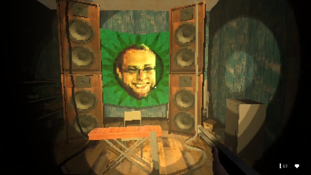 Some sort of recording booth. There is a green banner in the background featuring a man's face in front of a dark green sunburst. The man is smiling.